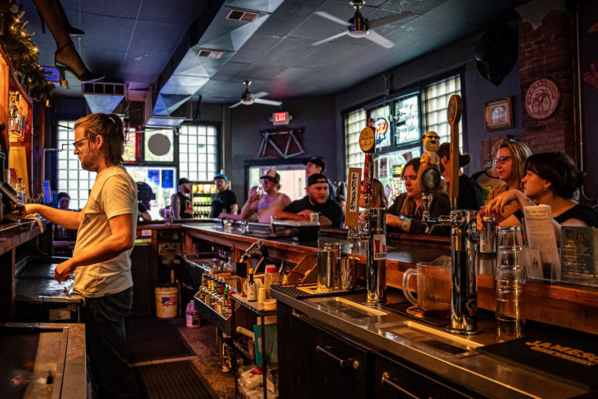  Interior, bar with a bartender and guests